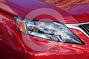 Closeup headlights red car