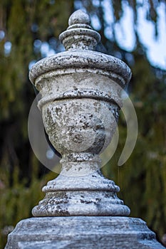 Closeup of headstone ornament at an old delapidated looking graveyard on a gray gloomy day in Upstate New York