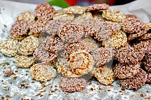 Closeup heap of Thai northern rice cracker snack `Khao tan`.