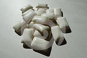 Closeup of heap of white pieces of chewing gum