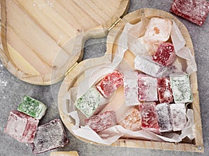 Closeup of heart shaped wooden box containing turkish delight