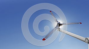 Closeup of helicopter tail rotor blade mechanism against blue sky