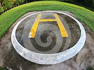 Closeup of helipad for landing helicopters on asphalt ground