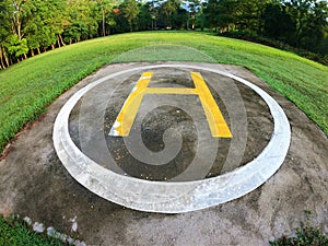 Closeup of helipad for landing helicopters on asphalt ground