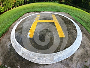 Closeup of helipad for landing helicopters on asphalt ground