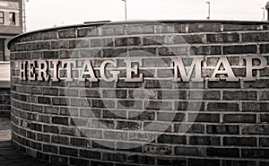 Closeup of heritage map words on a brick wall background