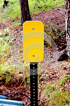 Closeup High Angle View of Blank Caution Signs along Iron Mountain Road