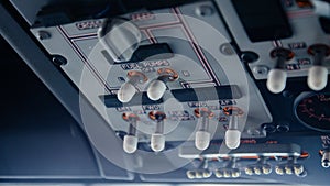 Closeup high detailed view of fuel pump control panel units of the overhead panel in the cockpit of modern jet civil passenger