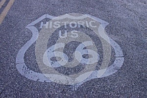 Closeup of a historic ROUTE 66 sign printed on a concrete road