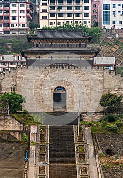 Closeup of historic town gate and houses along Yangtze river, Baidicheng, China