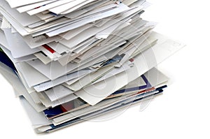 Closeup of home mails pile on white