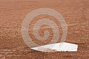 Closeup of home plate at baseball diamond