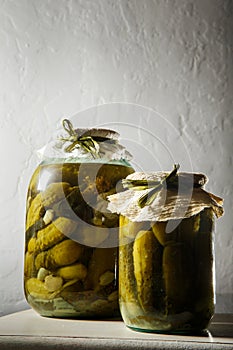 closeup homemade canned cucumbers in glass jars