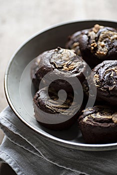 Closeup of homemade chocolate muffins on a tin dish