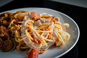 Closeup homemade spagetti with italian red sauce on plate