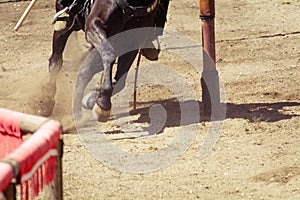 Closeup of the hooves from a horse while in galop on an race track