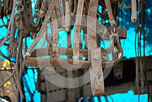 Closeup of horse saddles in a market at daytime