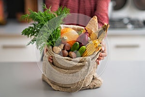 Closeup on housewife showing fresh vegetables