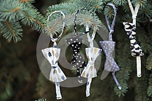 Closeup Ð¡hristmas tree decoration with garland of bowtie