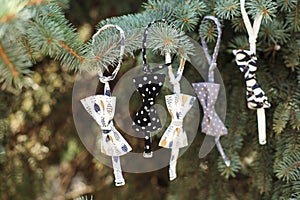 Closeup Ð¡hristmas tree decoration with garland of bowtie