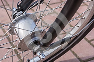 Hub dynamo in detail as a modern power generator on the bike photo