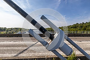 Closeup of huge metal steel anchor of tension cable of cable-stayed bridge