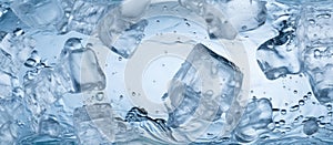 A closeup of ice cubes in freezing water, creating an electric blue hue