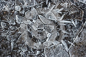 Closeup of an ice structure creating an abstract pattern on a stone wall