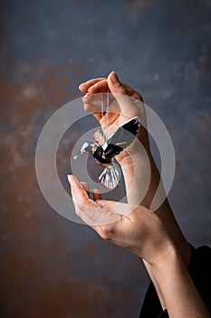 Closeup image of beautiful woman& x27;s hands with light pink manicure on the nails.