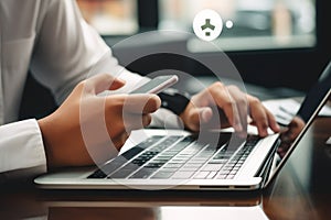 Closeup image of businesswoman using mobile phone and laptop in cafe, Businessman's hand using a smartphone and lapt