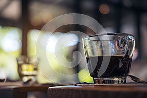 Closeup image of cups of hot coffee and tea on vintage wooden table in cafe