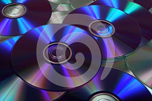 Closeup image of DVDs and CDs photo