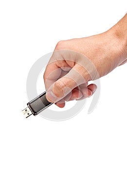 Closeup image: hand holding black USB data storage or connecting computer device with USB cable