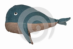 Closeup image of handmade toy blue whale pillow with ornament isolated at white background. The concept of home cozy interior