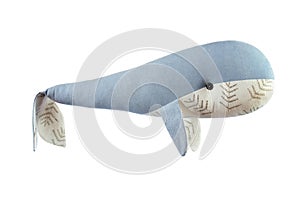 Closeup image of handmade toy whale pillow with ornament isolated