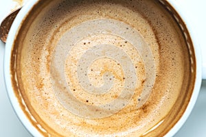 Closeup image of hot coffee in white muck photo