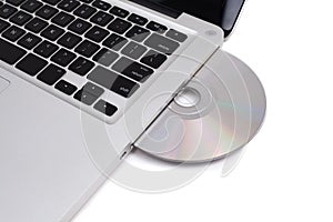 Closeup image from a laptop and a CDRom