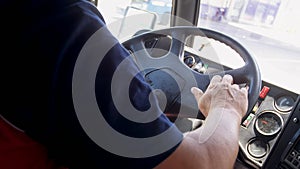 Closeup image of male bus driver in airport driving airport bus shuttle
