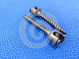 Spinal Pedicle Screws In Blue Background photo