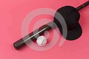 Closeup Image of Stylish Laquered Wooden Brown American Baseball Bat Placed With Clean Leather White Ball and Black Cap Over