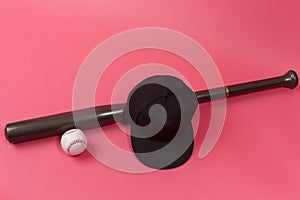 Closeup Image of Stylish Laquered Wooden Brown American Baseball Bat Placed With Clean Leather White Ball and Black Cap Over