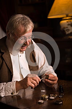 Victorian watchmaker with watches photo