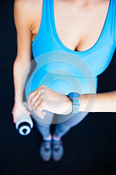 Closeup image of a woman with activity tracker