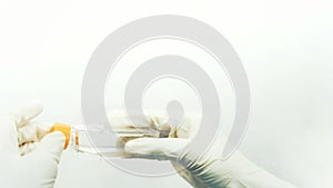 Closeup image of the woman researcher holds a cell culture flask for monolayers cells in the culture medium to do the lab test in