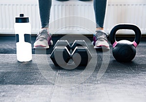 Closeup image of a woman sitting at gym