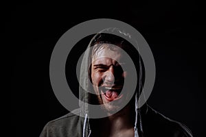 Closeup image of young man fulling of happiness. sportsmen is shouting loudly