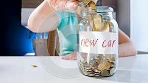 Closeup image of young woman colelcting money for buying new car. Concept of financial investment, economy growth and