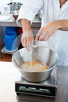 Closeup of incorporation of glucose and honey for sweet nougat