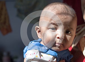 Closeup of Indian Baby girl gazing at camera