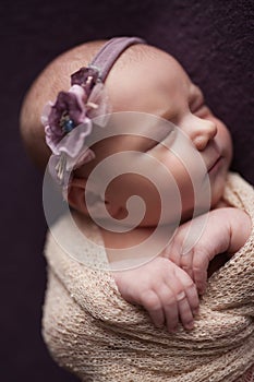 Closeup infant baby girl sleeping at background. Newborn and mothercare concept photo